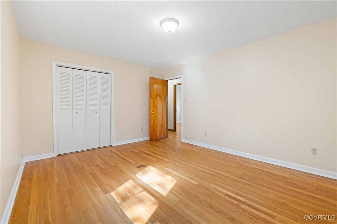4200 Esposito Place Prince George, VA 23875 - Photo 16 of 29 Unfurnished bedroom featuring light wood finished