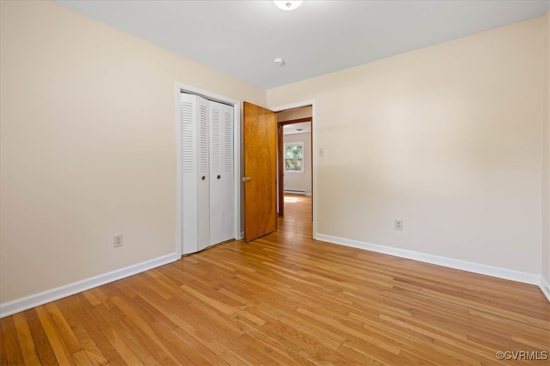 4200 Esposito Place Prince George, VA 23875 - Photo 20 of 29 Unfurnished bedroom featuring baseboards, light wo