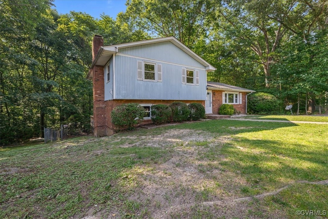 4200 Esposito Place Prince George, VA 23875 - Photo 2 of 29 Tri-level home featuring a chimney, a front lawn,