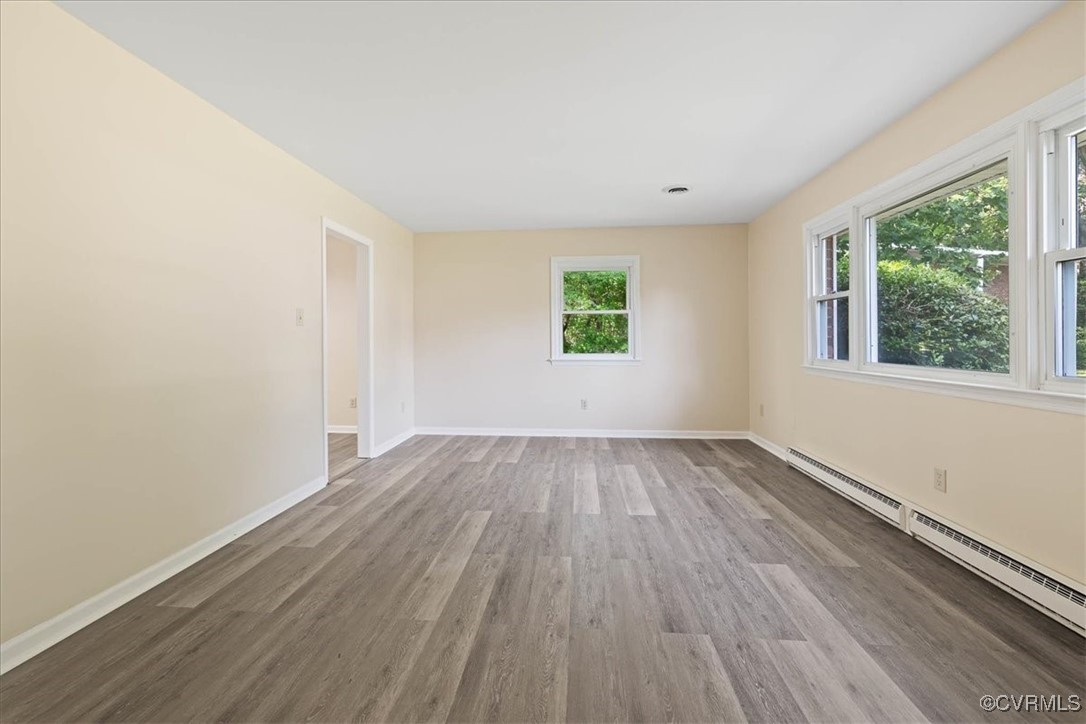 4200 Esposito Place Prince George, VA 23875 - Photo 5 of 29 Spare room featuring baseboard heating, wood finis