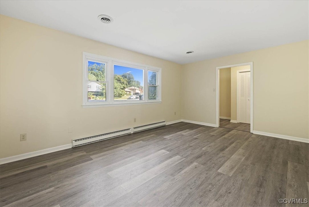 4200 Esposito Place Prince George, VA 23875 - Photo 6 of 29 Empty room featuring baseboard heating, wood finis