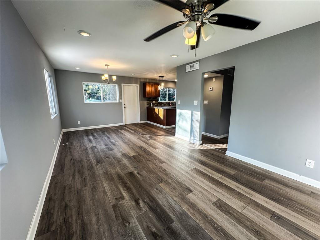 1277 Goodwin Road Northeast Atlanta, GA 30324 - Photo 11 of 21 wooden floor in an empty room with a window