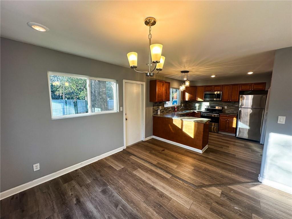 1277 Goodwin Road Northeast Atlanta, GA 30324 - Photo 12 of 21 a view of kitchen with wooden floor
