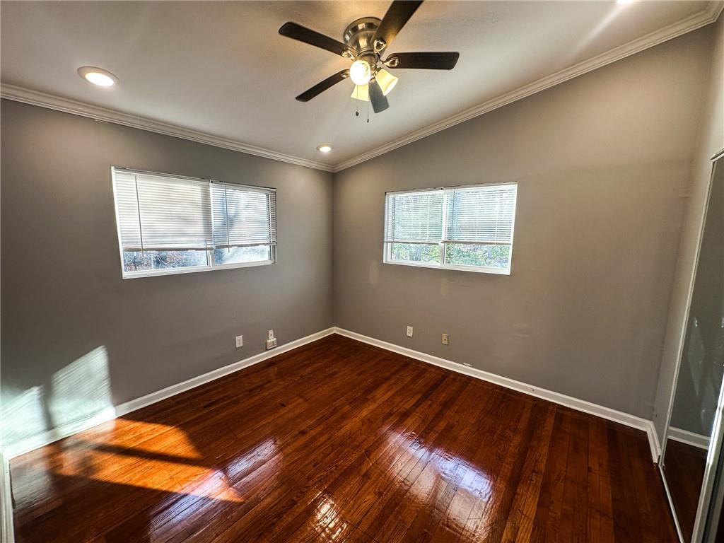 1277 Goodwin Road Northeast Atlanta, GA 30324 - Photo 18 of 21 a view of room with window and ceiling fan