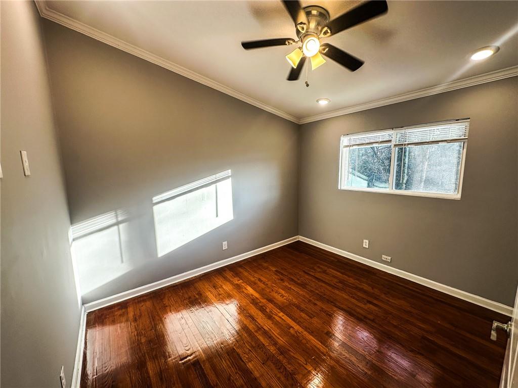 1277 Goodwin Road Northeast Atlanta, GA 30324 - Photo 19 of 21 wooden floor in an empty room with a window