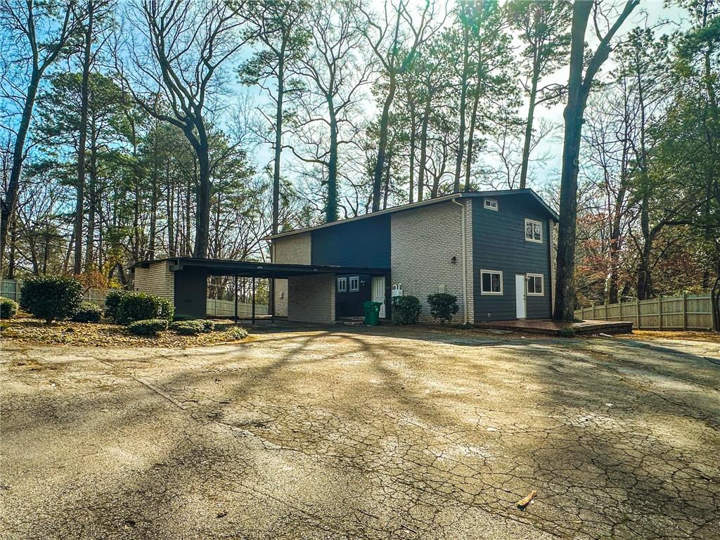 1277 Goodwin Road Northeast Atlanta, GA 30324 - Photo 3 of 21 a house that has a tree in front of it
