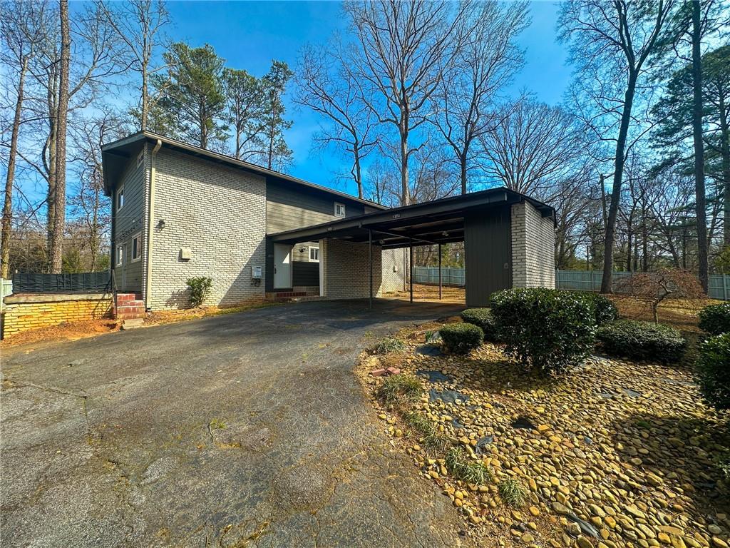 1277 Goodwin Road Northeast Atlanta, GA 30324 - Photo 5 of 21 a view of a house with a yard