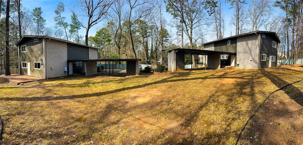 1277 Goodwin Road Northeast Atlanta, GA 30324 - Photo 6 of 21 a view of a house with a large tree