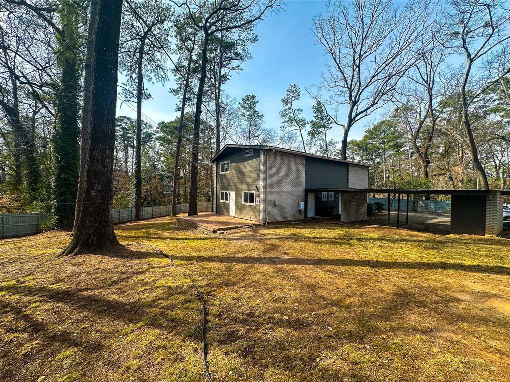 1277 Goodwin Road Northeast Atlanta, GA 30324 - Photo 8 of 21 a view of a house with pool and a yard
