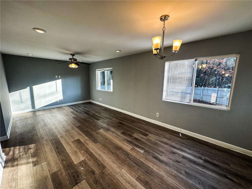 1277 Goodwin Road Northeast Atlanta, GA 30324 - Photo 10 of 21 a view of an empty room with wooden floor and a window