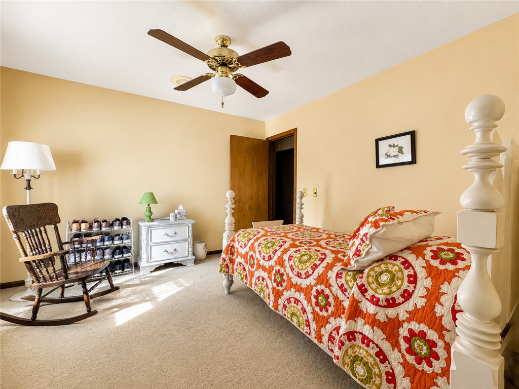 222 Terrace Drive Anderson, SC 29621 - Photo 20 of 37 Well-lit room with plush carpeting and a classic ceiling fan, offering a comfortable retreat.