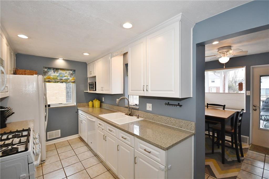 1939 Spring Valley Road Pittsburgh, PA 15243 - Photo 11 of 25 Gorgeous Granite Countertops! Recessed lighting! OPEN to the breakfast area as you can see !