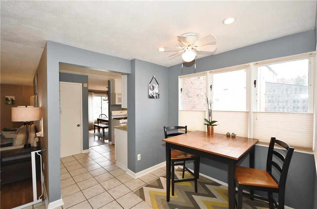1939 Spring Valley Road Pittsburgh, PA 15243 - Photo 14 of 25 Breakfast Nook area w/ceramic flooring flowing from kitchen, Wall of windows for morning light! This is flexible space also..dont need a nook, put your office desk there!