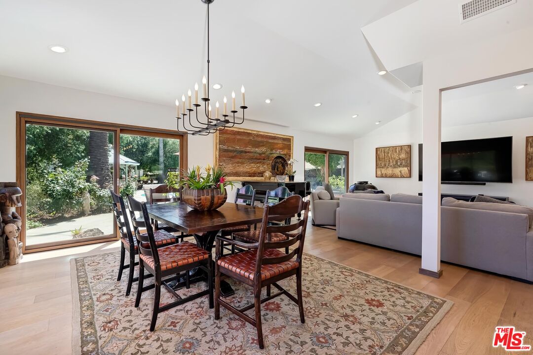 24537 Dry Canyon Cold Creek Road Calabasas, CA 91302 - Photo 11 of 54 a view of a dining room with furniture window and wooden floor