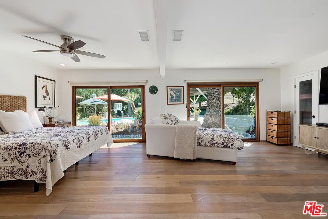 24537 Dry Canyon Cold Creek Road Calabasas, CA 91302 - Photo 18 of 54 a bed room with bed and windows