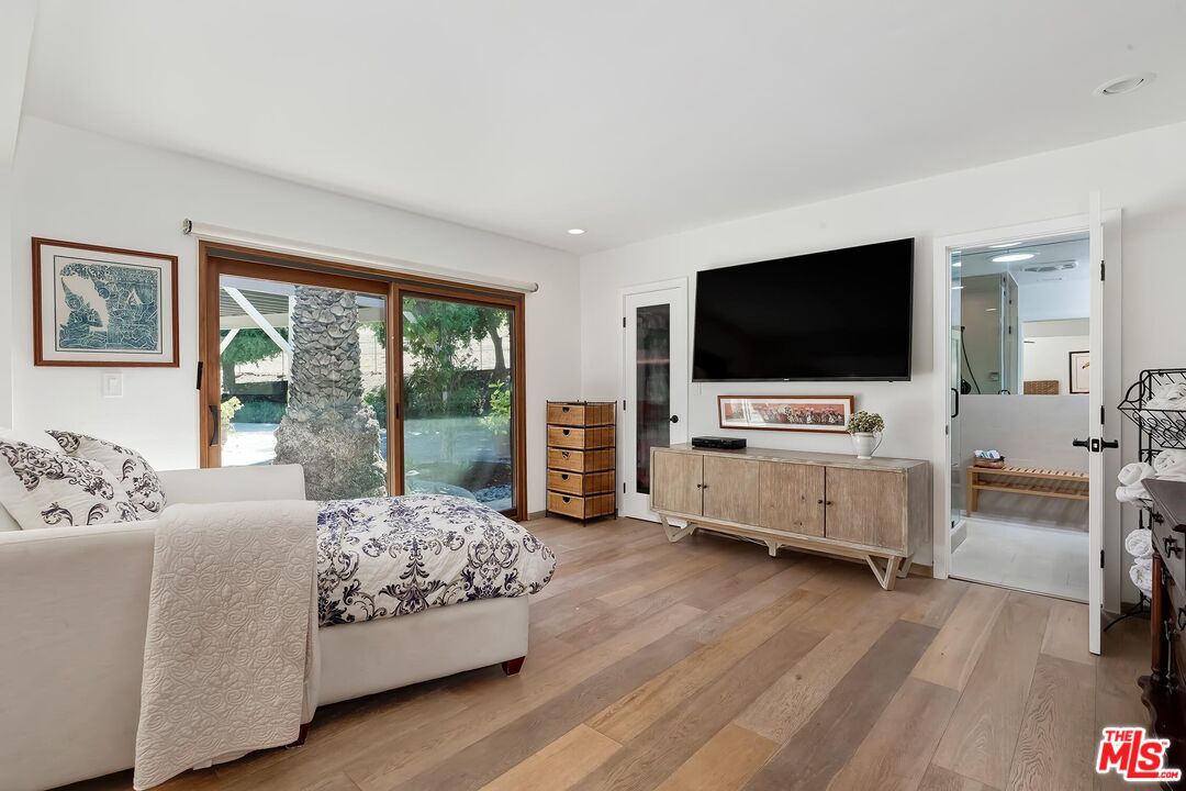 24537 Dry Canyon Cold Creek Road Calabasas, CA 91302 - Photo 20 of 54 a living room with furniture and flat screen tv