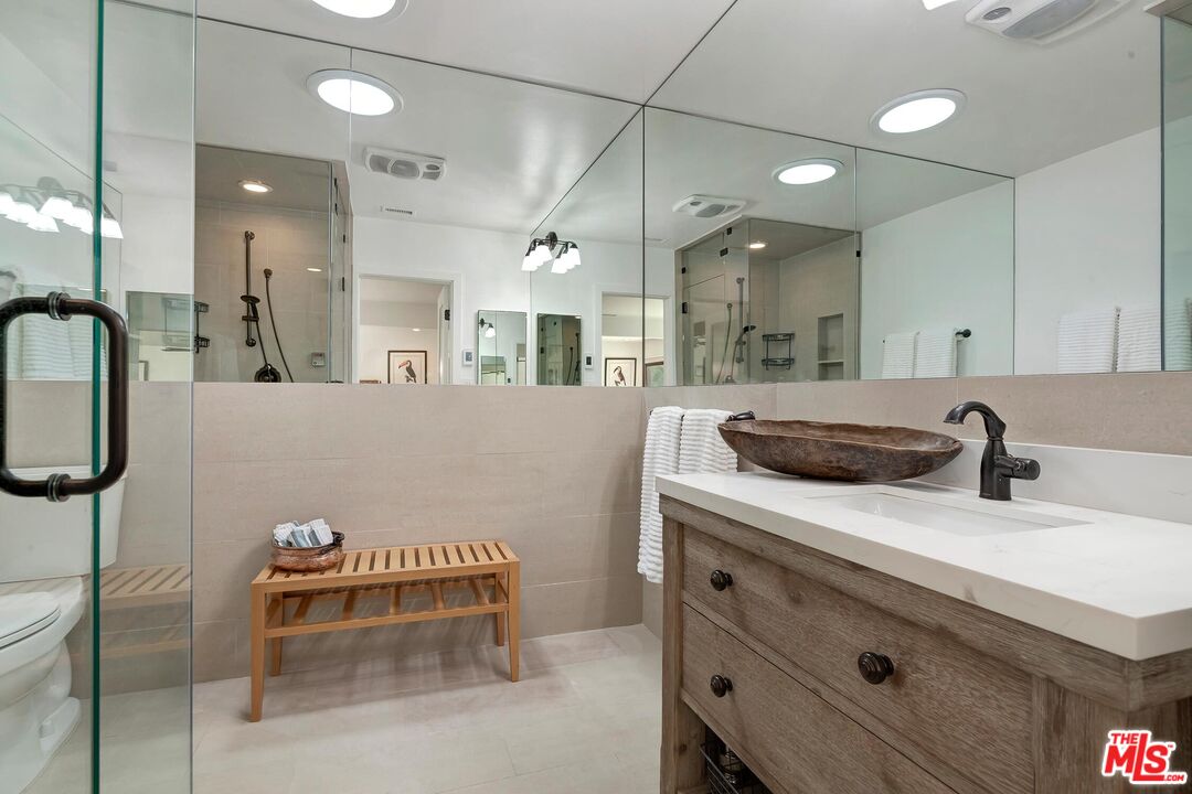 24537 Dry Canyon Cold Creek Road Calabasas, CA 91302 - Photo 21 of 54 a kitchen with a sink and cabinets