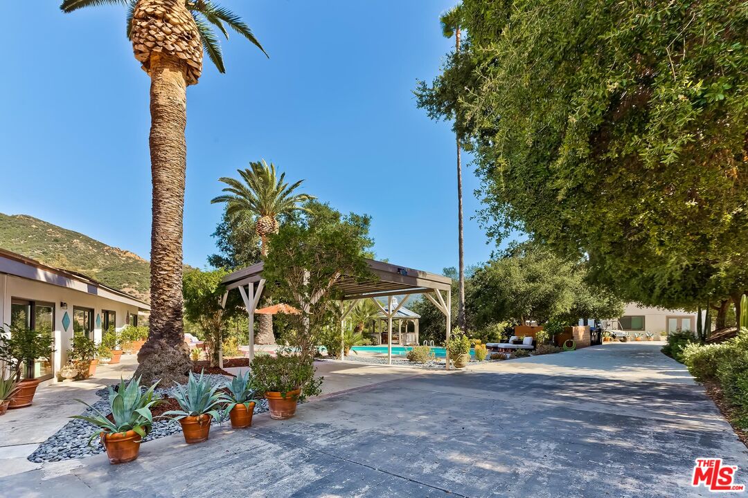 24537 Dry Canyon Cold Creek Road Calabasas, CA 91302 - Photo 31 of 54 a view of a street with a building in the background
