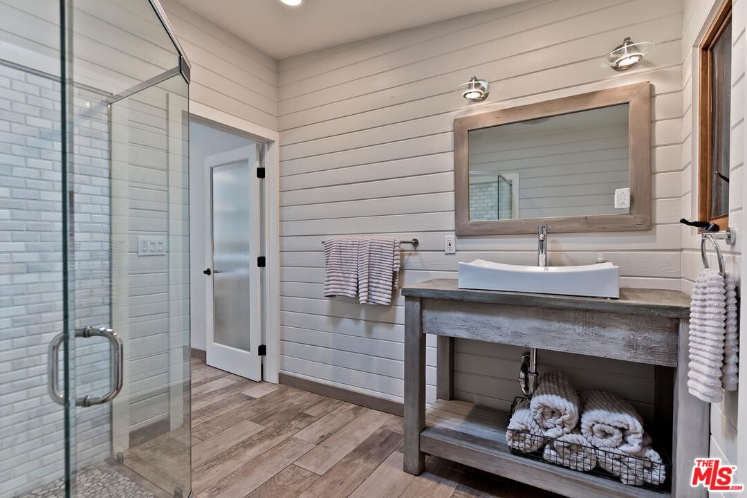24537 Dry Canyon Cold Creek Road Calabasas, CA 91302 - Photo 34 of 54 a bathroom with a sink and a fireplace