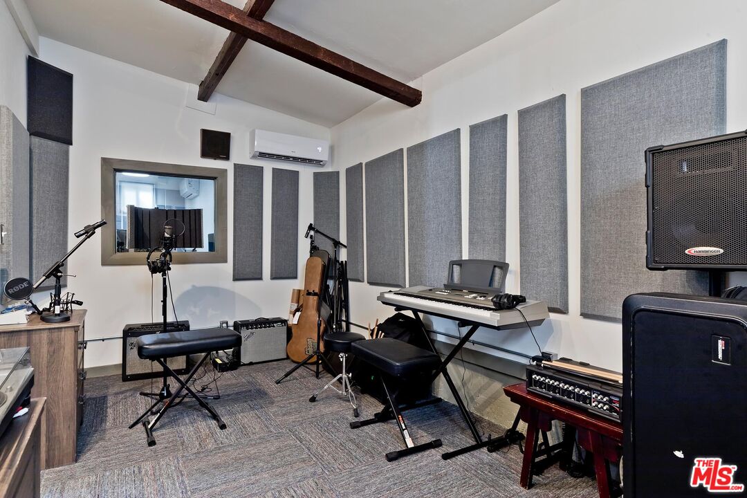 24537 Dry Canyon Cold Creek Road Calabasas, CA 91302 - Photo 37 of 54 a view of a livingroom with furniture and a flat screen tv