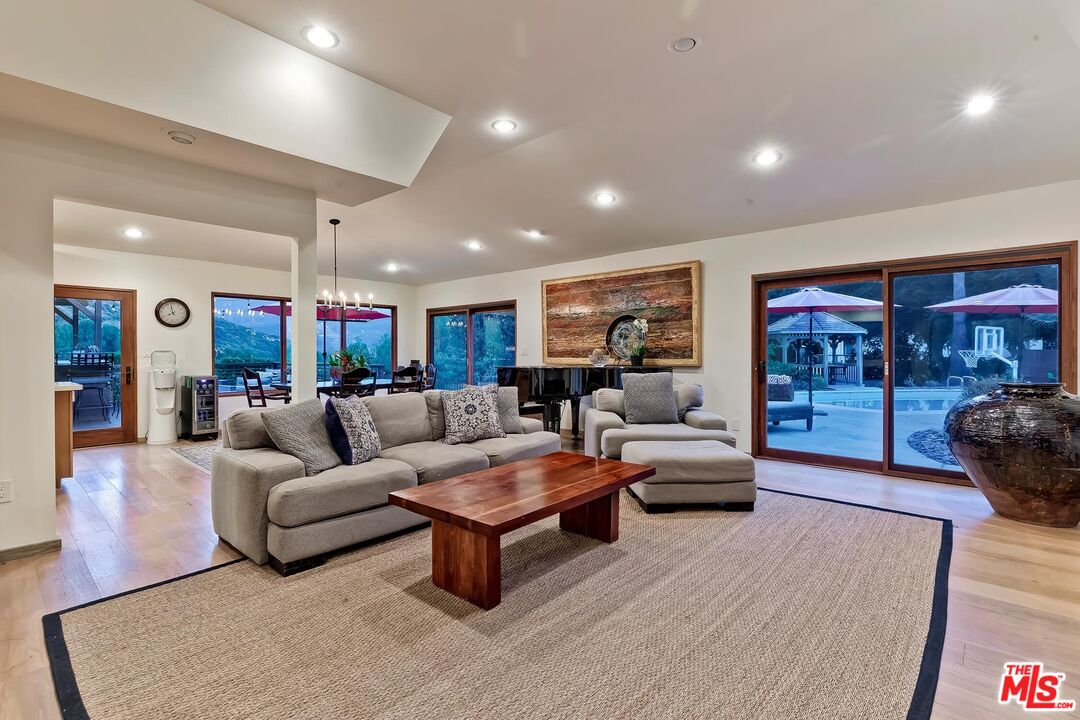 24537 Dry Canyon Cold Creek Road Calabasas, CA 91302 - Photo 41 of 54 a living room with furniture and a fireplace