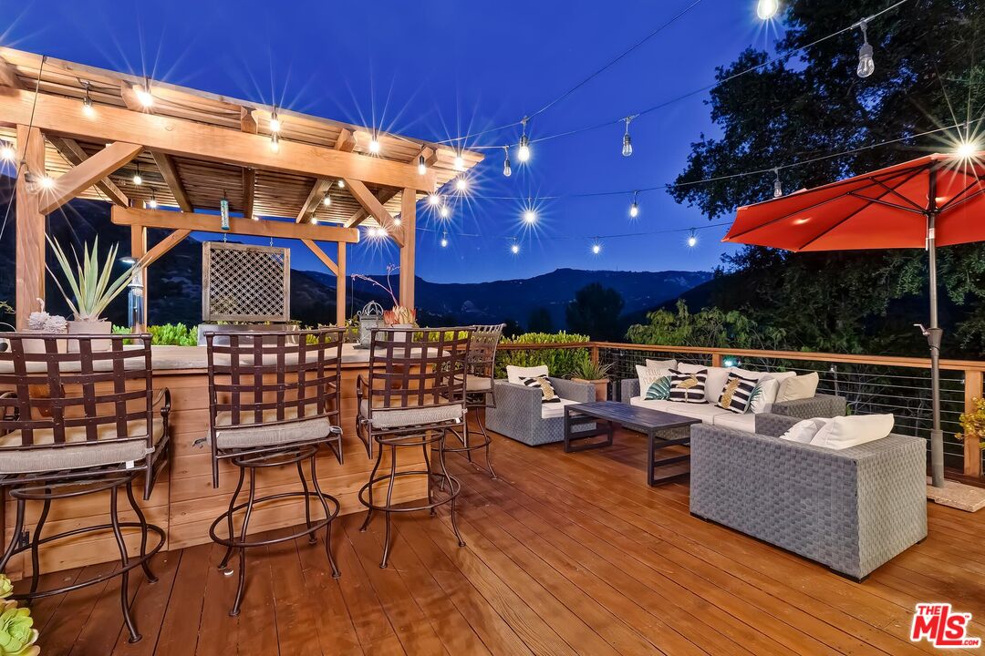 24537 Dry Canyon Cold Creek Road Calabasas, CA 91302 - Photo 48 of 54 a outdoor living space with patio furniture and a fireplace