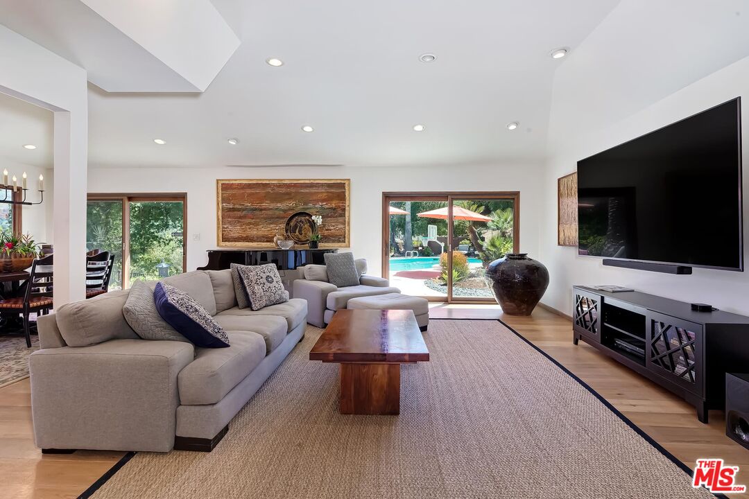 24537 Dry Canyon Cold Creek Road Calabasas, CA 91302 - Photo 6 of 54 a living room with furniture and a flat screen tv