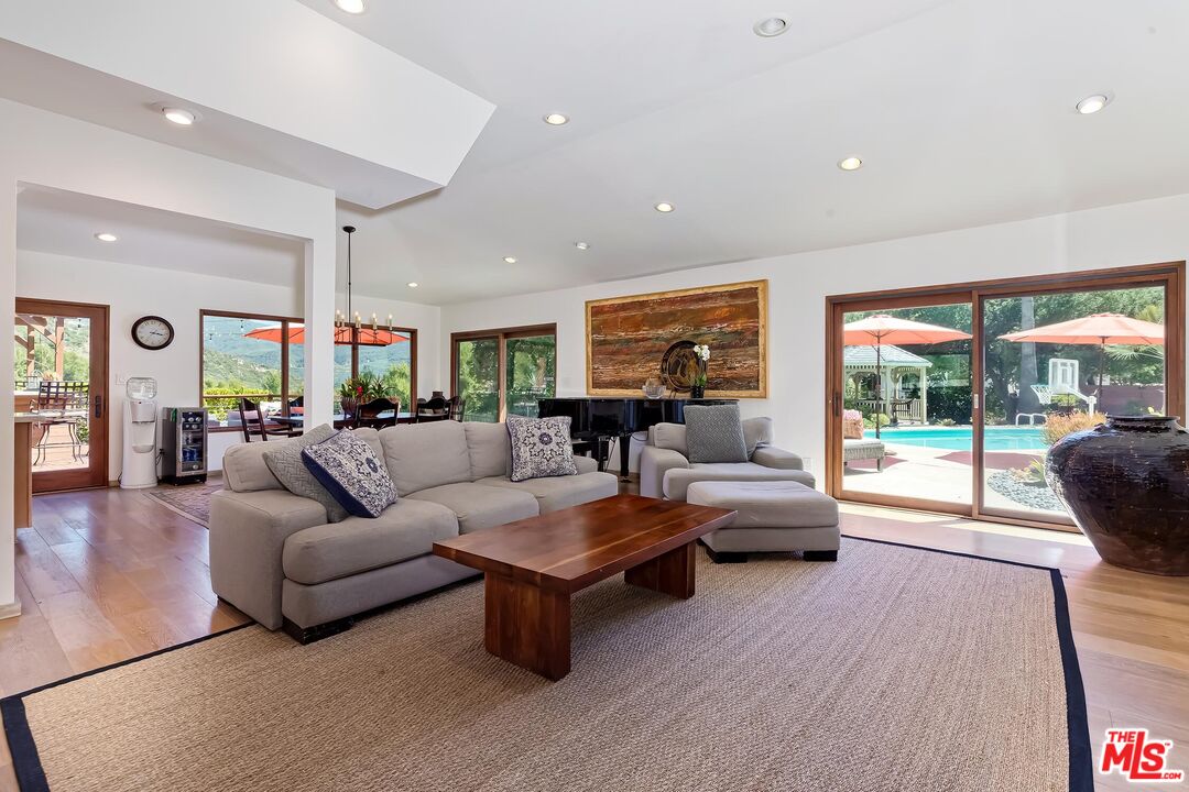 24537 Dry Canyon Cold Creek Road Calabasas, CA 91302 - Photo 7 of 54 a living room with furniture and a large window