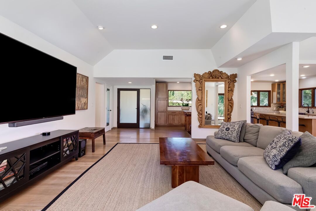 24537 Dry Canyon Cold Creek Road Calabasas, CA 91302 - Photo 8 of 54 a living room with furniture and a flat screen tv