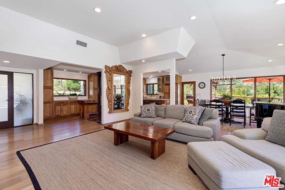 24537 Dry Canyon Cold Creek Road Calabasas, CA 91302 - Photo 9 of 54 a living room with furniture and a wooden floor