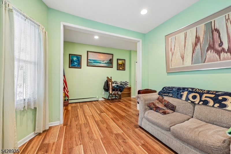 50 Preston Street Ridgefield Park, NJ 07660 - Photo 10 of 41 a living room with furniture and a wooden floor