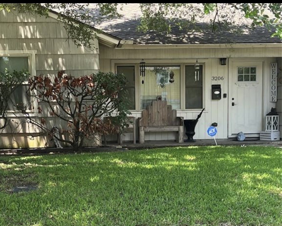 3206 Jarvis Street Houston, TX 77063 - Photo 1 of 6 front view of house with a yard
