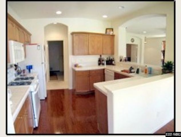 1798 Trek Trail Reno, NV 89521 - Photo 3 of 7 a kitchen with a sink a stove and refrigerator