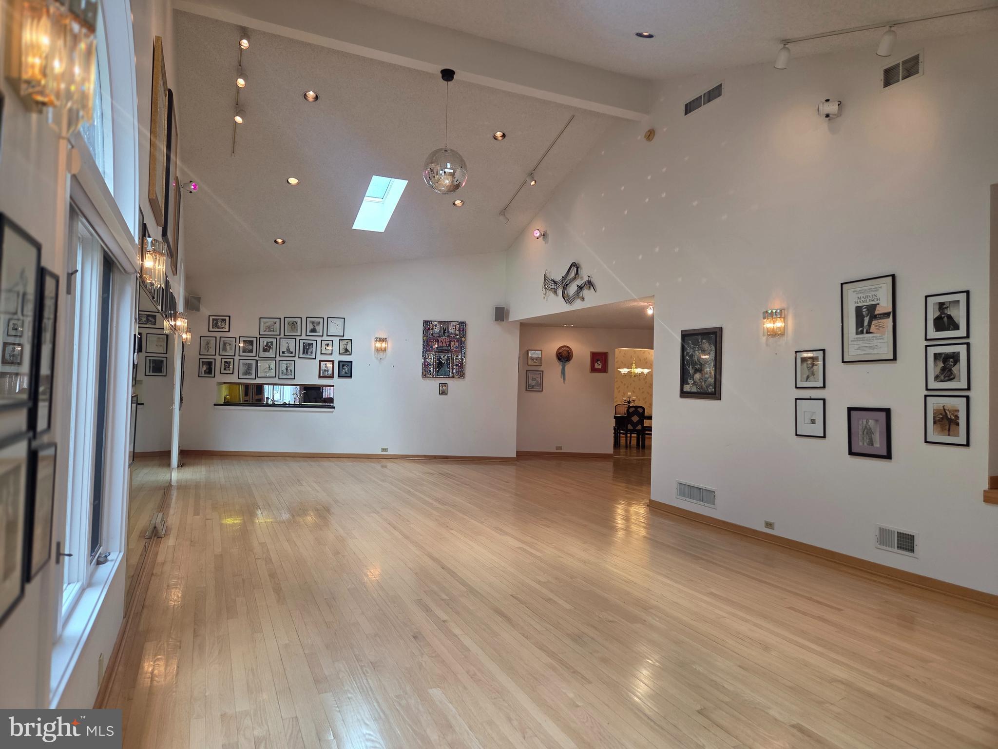 1617 Meadowlark Road Wyomissing, PA 19610 - Photo 14 of 35 a view of a big room with wooden floor and windows