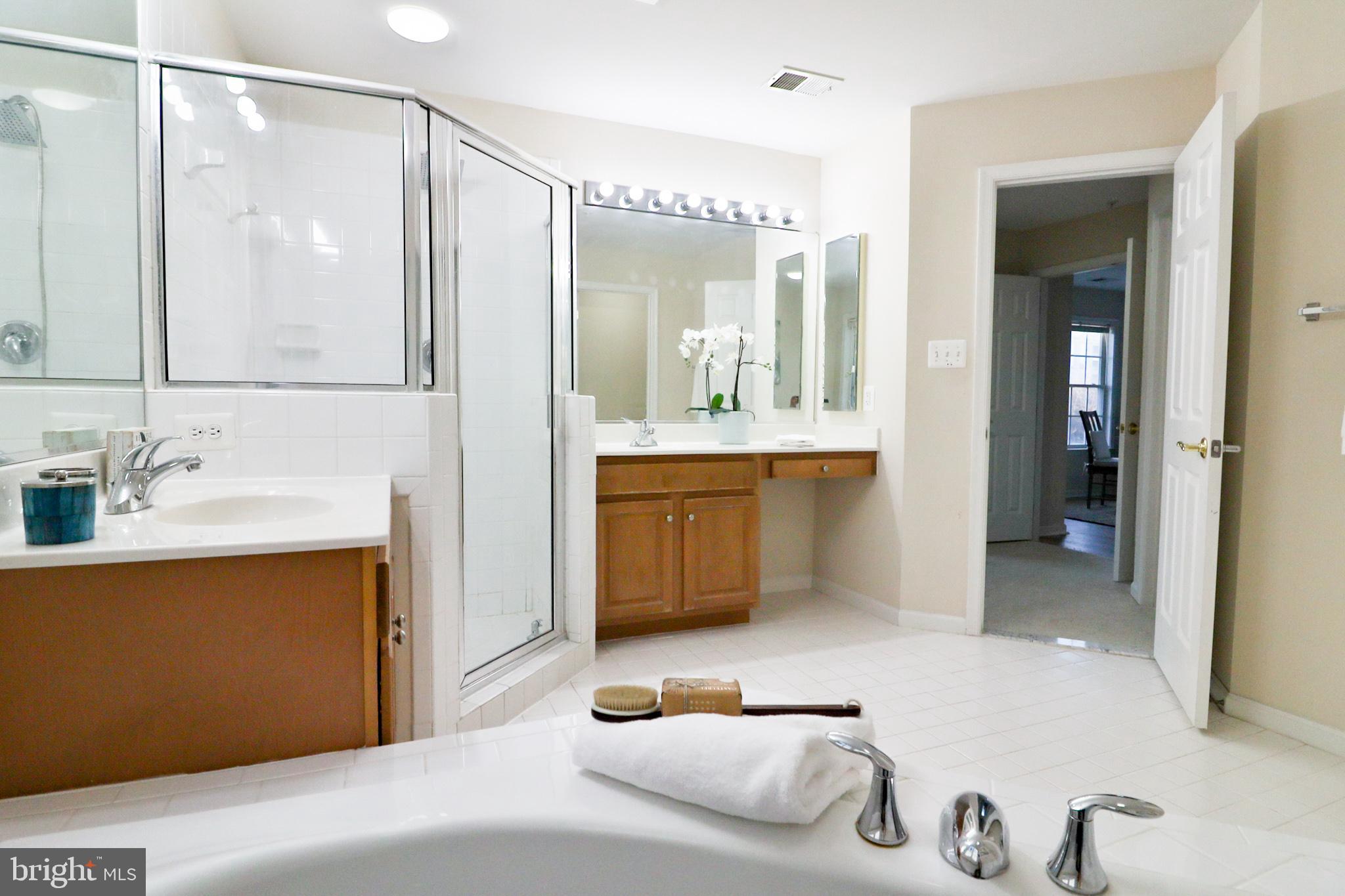1006 Gaither Road Rockville, MD 20850 - Photo 43 of 68 Large primary bathroom, two sinks, oversize tub
