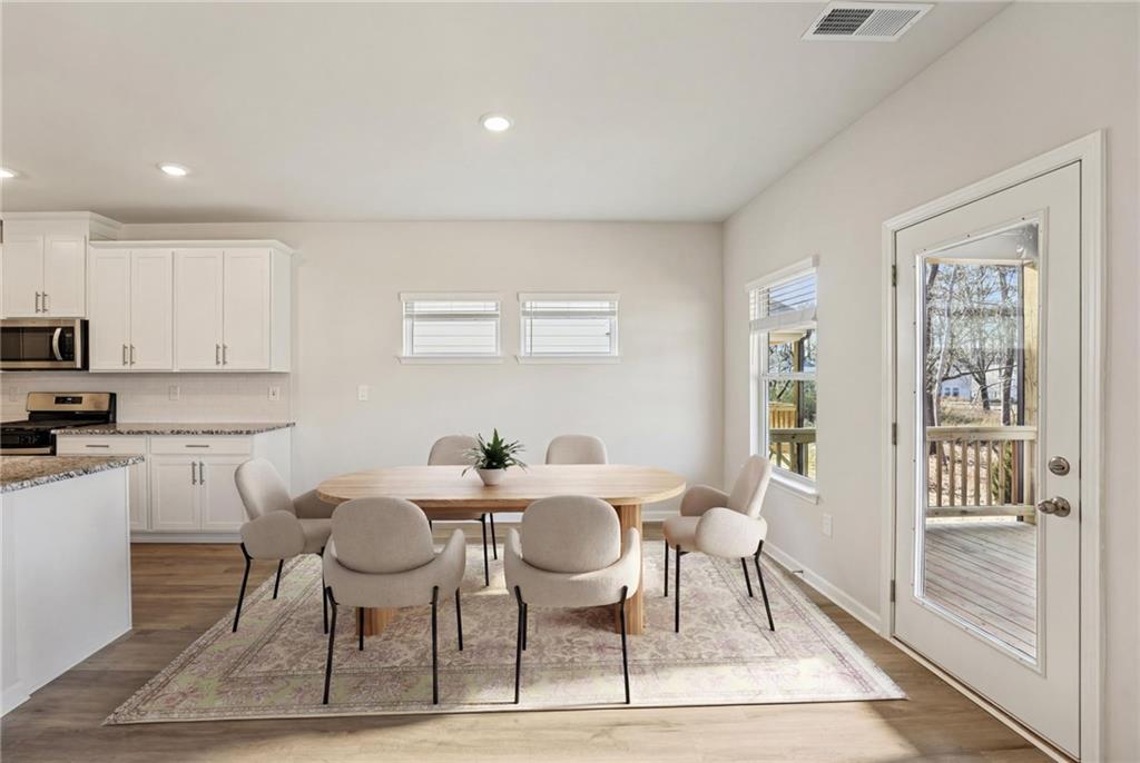 4412 Brick Tunl Street Powder Springs, GA 30127 - Photo 19 of 72 a view of a dining room with furniture