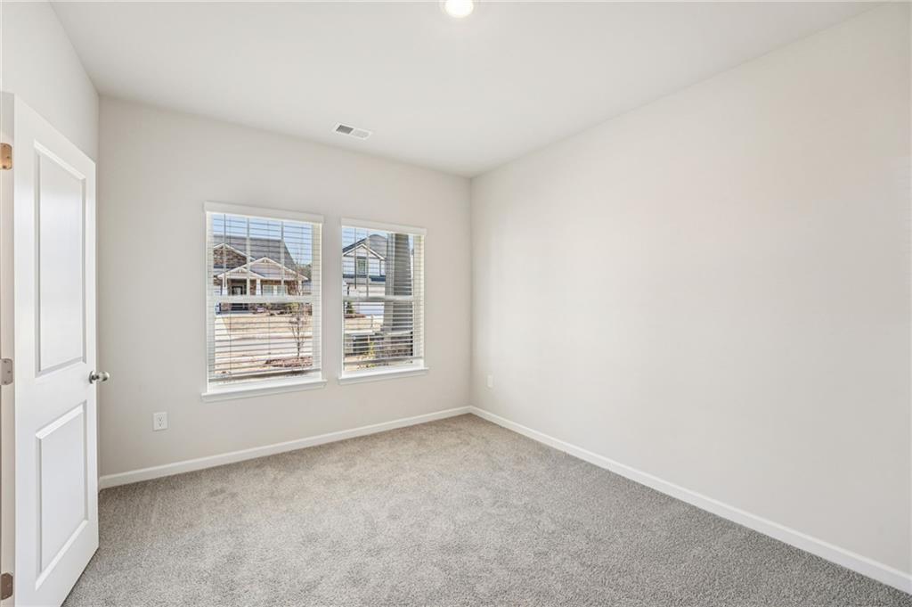 4412 Brick Tunl Street Powder Springs, GA 30127 - Photo 31 of 72 an empty room with a window