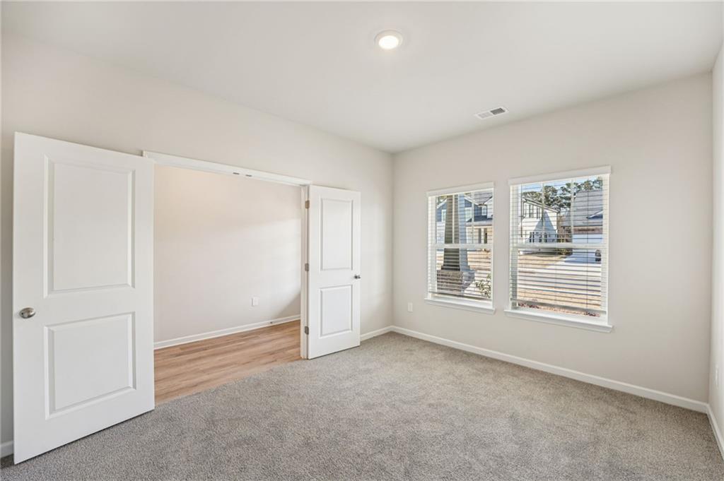 4412 Brick Tunl Street Powder Springs, GA 30127 - Photo 32 of 72 a view of an empty room with a window