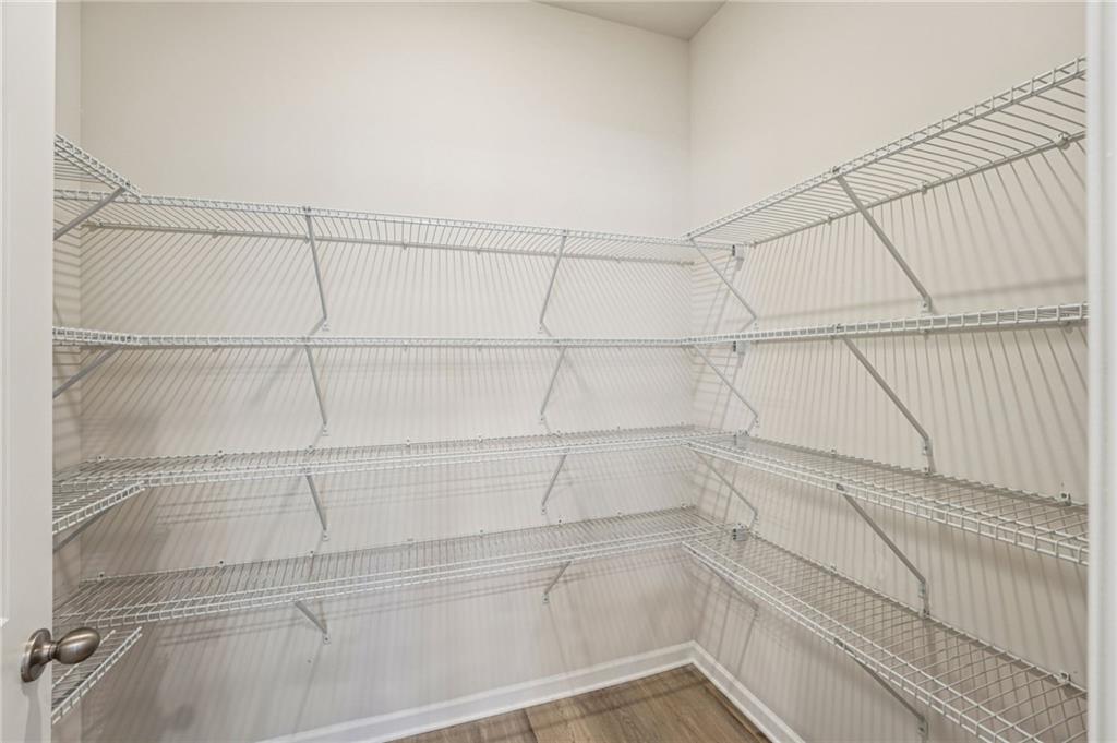 4412 Brick Tunl Street Powder Springs, GA 30127 - Photo 34 of 72 a view of a room with racks on the wall