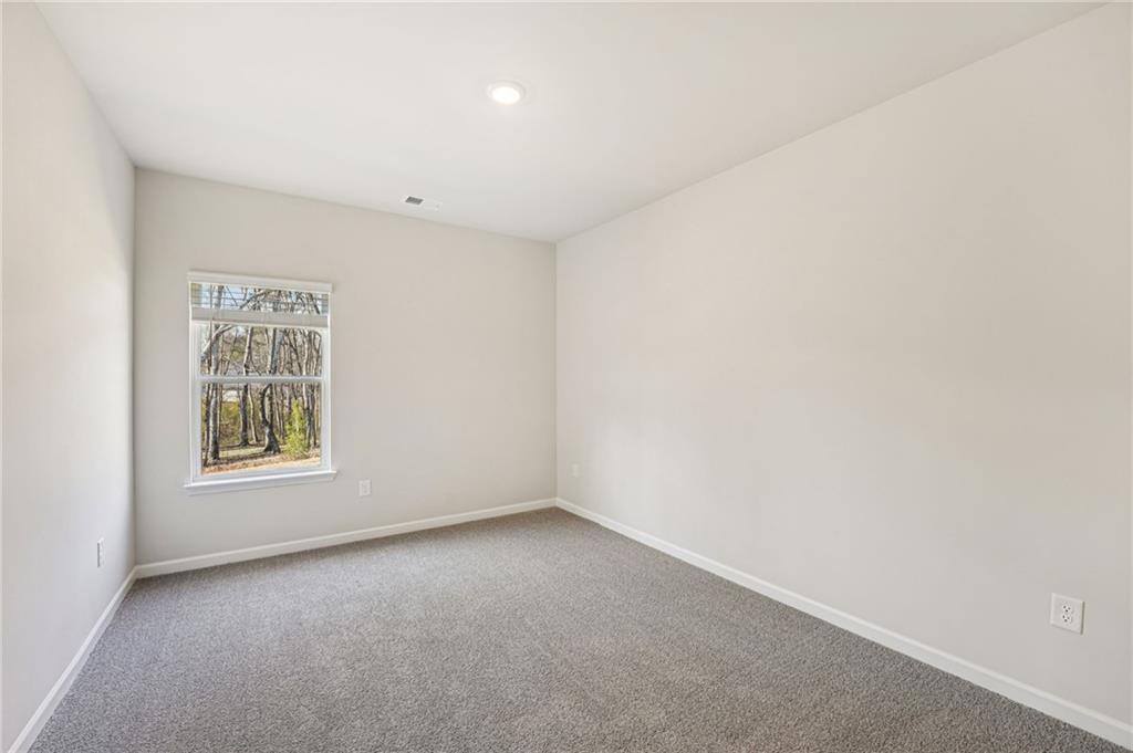 4412 Brick Tunl Street Powder Springs, GA 30127 - Photo 36 of 72 an empty room with a window