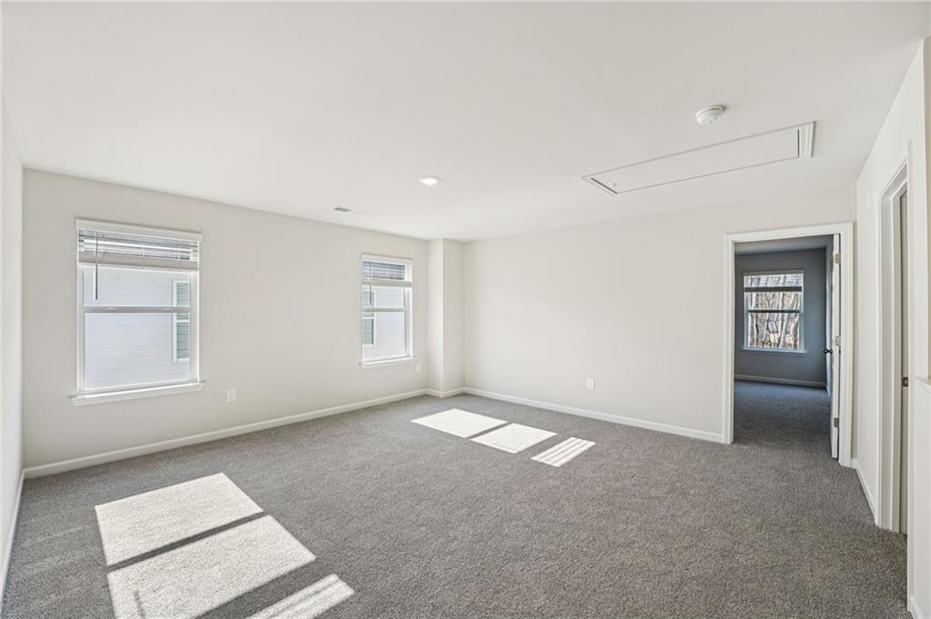 4412 Brick Tunl Street Powder Springs, GA 30127 - Photo 38 of 72 an empty room with windows