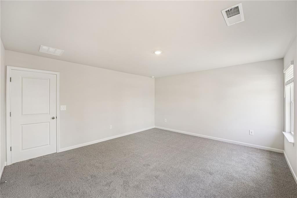4412 Brick Tunl Street Powder Springs, GA 30127 - Photo 48 of 72 a view of an empty room