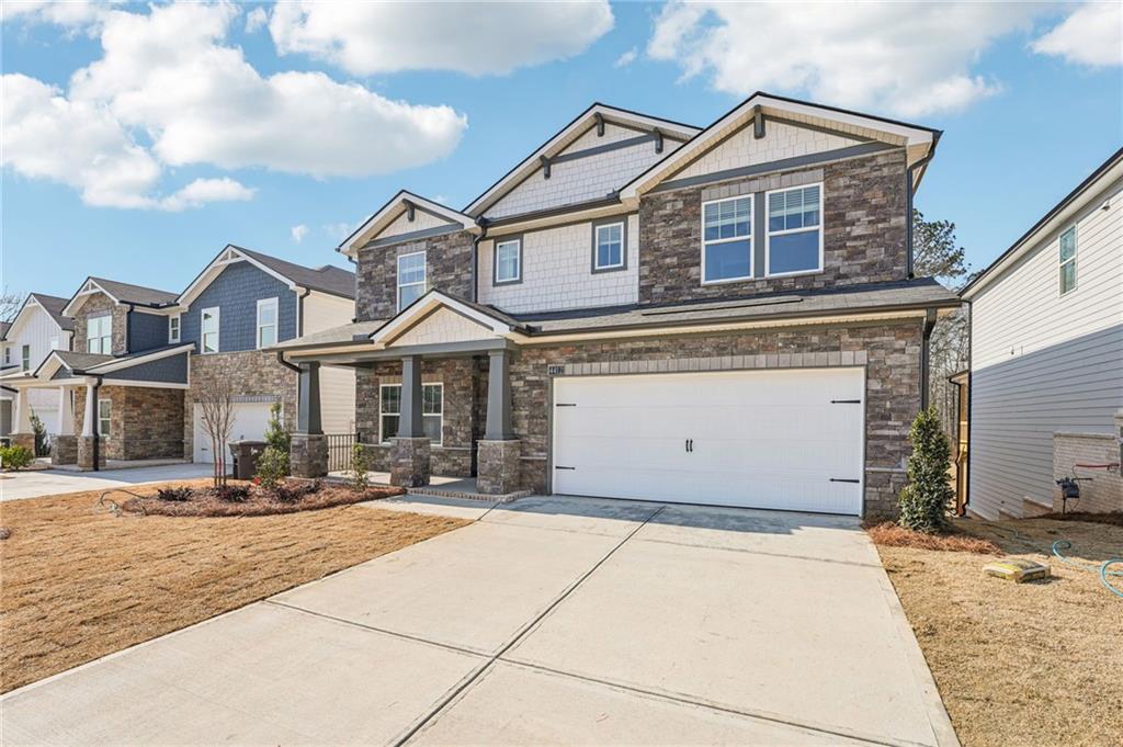 4412 Brick Tunl Street Powder Springs, GA 30127 - Photo 5 of 72 a front view of a house with yard