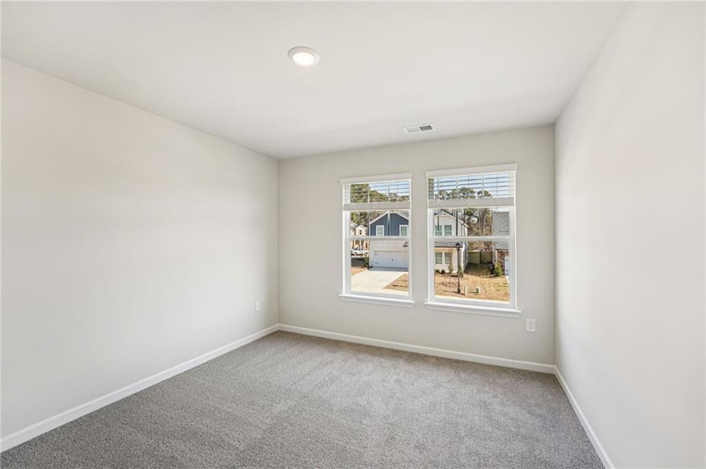 4412 Brick Tunl Street Powder Springs, GA 30127 - Photo 57 of 72 an empty room with a window
