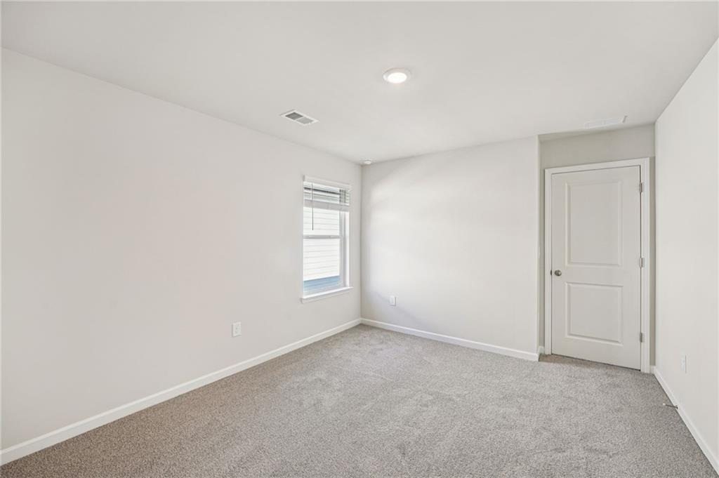 4412 Brick Tunl Street Powder Springs, GA 30127 - Photo 59 of 72 an empty room with windows