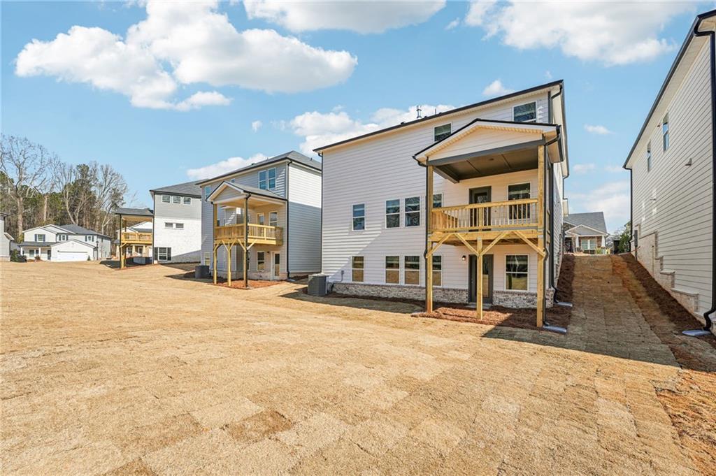 4412 Brick Tunl Street Powder Springs, GA 30127 - Photo 68 of 72 a view of a house with basketball court