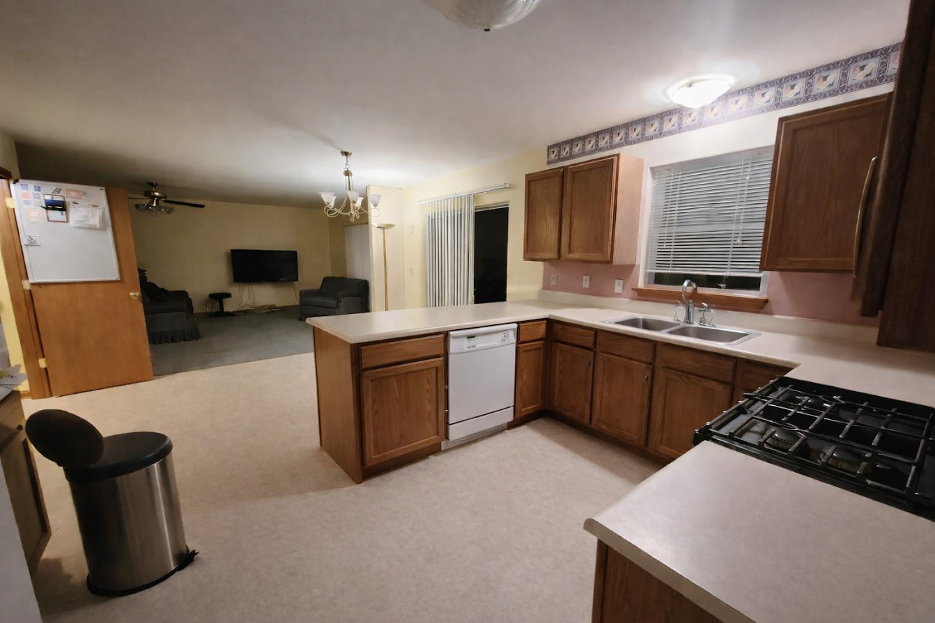 1819 Lake Shore Drive Romeoville, IL 60446 - Photo 6 of 16 a kitchen with a sink stove and cabinets