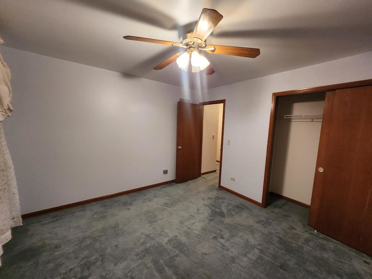 1819 Lake Shore Drive Romeoville, IL 60446 - Photo 7 of 16 an empty room with closet and fan