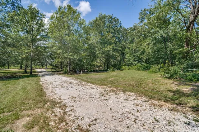 a view of outdoor space with deck and yard
