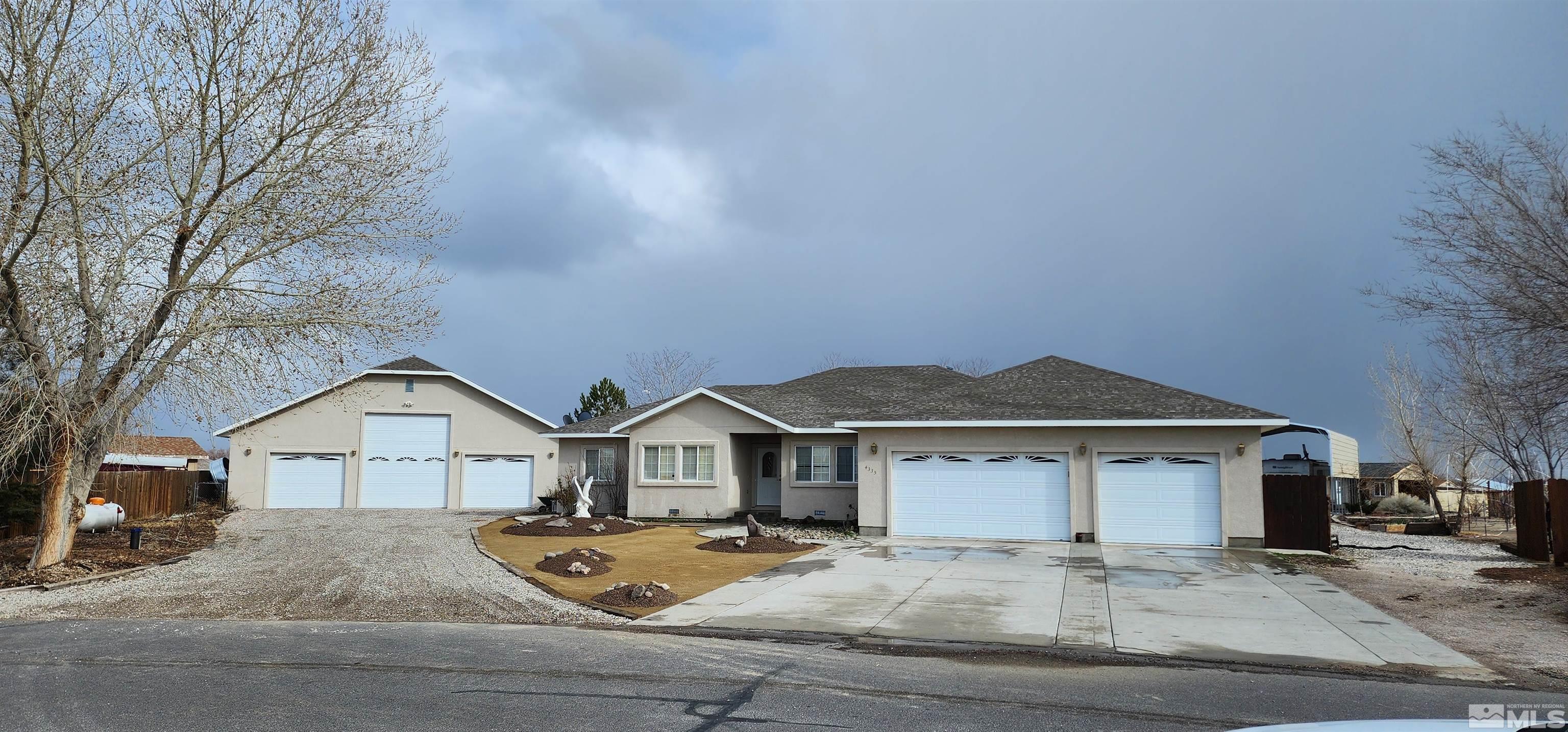 4335 Rancheria Road Fallon, NV 89406 - Photo 1 of 36 a front view of a house with garden